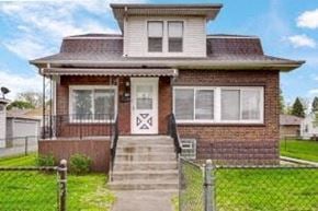 Whiting apartment for rent - the front of a brick house with a fence