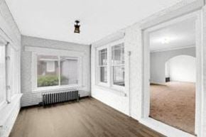 Whiting apartment for rent - a living room with a wooden floor and a large window