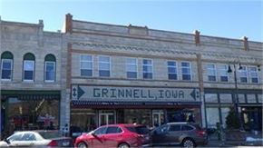 Grinnell apartment for rent - A building with a sign that says Grinnell Iowa.