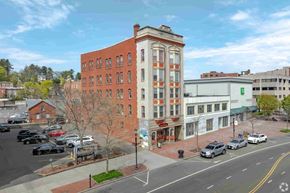 New Britain apartment for rent - A street view of a city with cars and buildings.