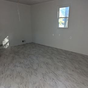 Cary apartment for rent - an empty room with white marble floors and a window