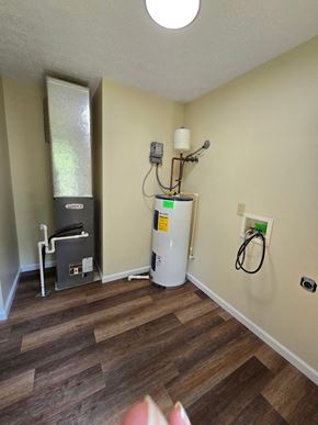Morehead house for rent - a small room with a water heater and a humidifier