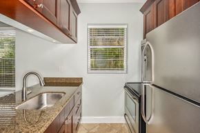 Tampa apartment for rent - a kitchen with stainless steel appliances and granite counter tops