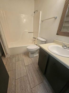 Pensacola house for rent - a bathroom with a toilet and a sink and a bath tub