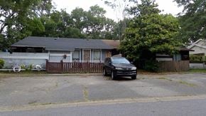 Pensacola house for rent - a car parked in front of a house