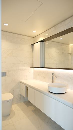 Vancouver apartment for rent - A white bathroom with a toilet and sink.