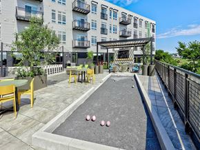 Dorchester apartment for rent - a pool with pink balls on it in front of an apartment building