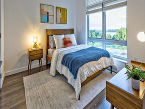 Dorchester apartment for rent - a bedroom with a bed and a large window