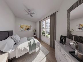 Charlotte apartment for rent - a bedroom with a bed and a ceiling fan