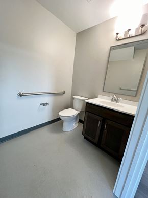 Agawam apartment for rent - A white toilet sits next to a sink in a bathroom.