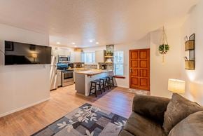 Albuquerque apartment for rent - A kitchen with a bar and a couch.