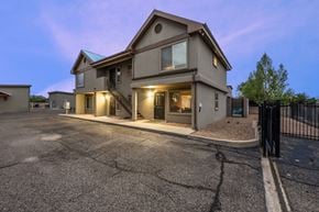 Albuquerque apartment for rent - A house with a driveway and a gate in front.