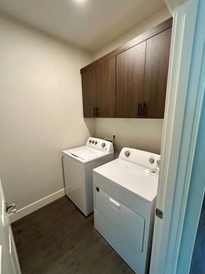 Bend apartment for rent - A small laundry room with a washer and dryer.