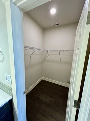 Bend apartment for rent - a walk in closet in a bathroom with empty shelves