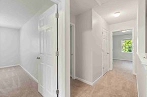 Fuquay-Varina house for rent - a bedroom with a closet and a door to a bathroom