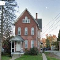 Royersford apartment for rent - A red brick house with a white door and windows.