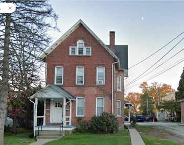 Royersford apartment for rent - A red brick house with a white door and windows.