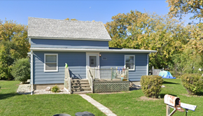 Manvel house for rent - a blue house with a yard and a porch