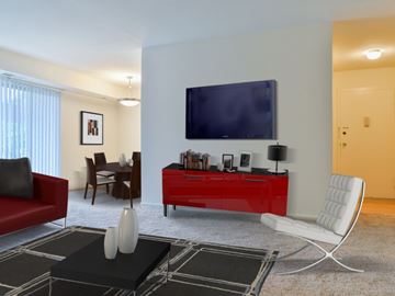Frederick apartment for rent - a living room with a red dresser and a television on the wall