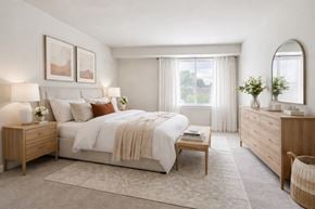 Baltimore apartment for rent - a kitchen with black appliances and wooden cabinets