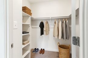 Baltimore apartment for rent - a bedroom with a large bed and a tv on the wall