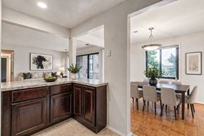 Catonsville apartment for rent - a kitchen with stainless steel appliances and dark wood cabinets