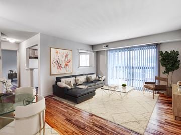Baltimore apartment for rent - a living room with a couch and a table and a window