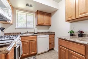 Aberdeen apartment for rent - a white stove top oven in a kitchen with a microwave above it