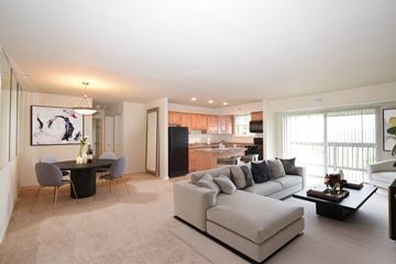 Towson apartment for rent - a living room and dining room with a couch and a table