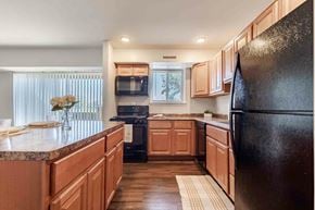 Towson apartment for rent - a living room and kitchen with a couch and a table
