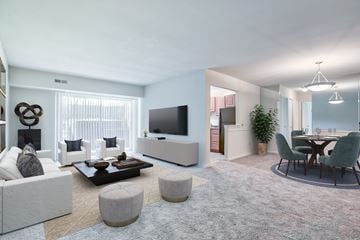 Baltimore apartment for rent - a living room with couches and a table and a television