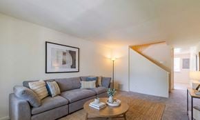 Edgewood apartment for rent - a kitchen with black appliances and wooden cabinets