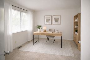 Baltimore apartment for rent - a kitchen with white appliances and wooden cabinets