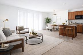 Hagerstown apartment for rent - a living room and kitchen with a couch and a table