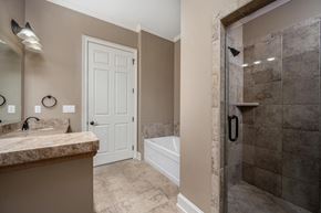 Murfreesboro apartment for rent - A bathroom with a white door and a marble countertop.