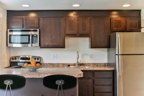 Severn apartment for rent - a kitchen with wooden cabinets and stainless steel appliances