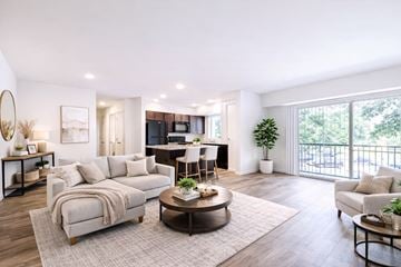 Linthicum apartment for rent - A modern living room with a large couch and a coffee table.