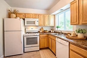 Linthicum apartment for rent - A bedroom with a bed, a dresser, and a television.