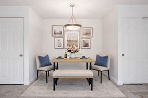 Catonsville apartment for rent - A kitchen with dark brown cabinets and a stove top oven.