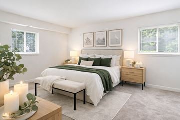 Catonsville apartment for rent - A living room with a white couch and a coffee table.