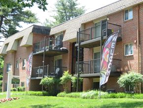 Sykesville apartment for rent - A building with a balcony and a sign that says "Welcome".