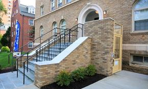 Baltimore apartment for rent - A brick building with a staircase leading to a door.