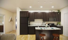 Baltimore apartment for rent - A kitchen with dark brown cabinets and a white counter top.