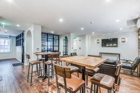 Baltimore apartment for rent - A dining room with a wooden table and chairs.