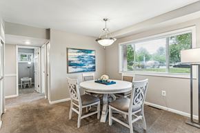 Baltimore apartment for rent - A dining room with a white table and chairs.