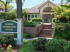 Glen Burnie apartment for rent - A leasing information center sign is in front of a building.