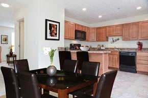 Glen Burnie apartment for rent - A dining room with a table and chairs.