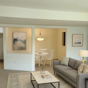 Hagerstown apartment for rent - A spacious empty room with carpeted floor and white walls.