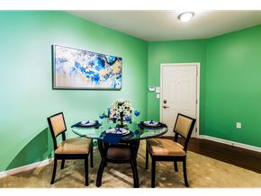 Aberdeen apartment for rent - A dining room with a glass table and chairs.