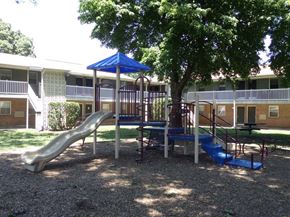 Newport News apartment for rent - a playground in a yard in front of a building